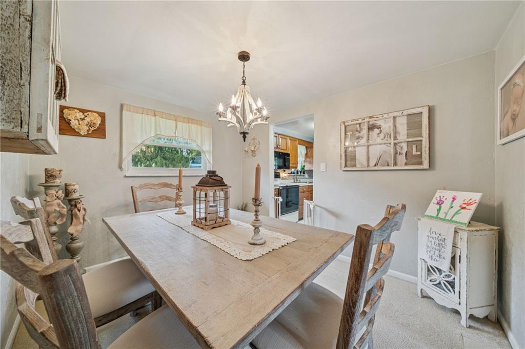 12629 Deborah Drive Irwin, PA 15642 - Photo 9 of 33 a view of a dining room with furniture and chandelier
