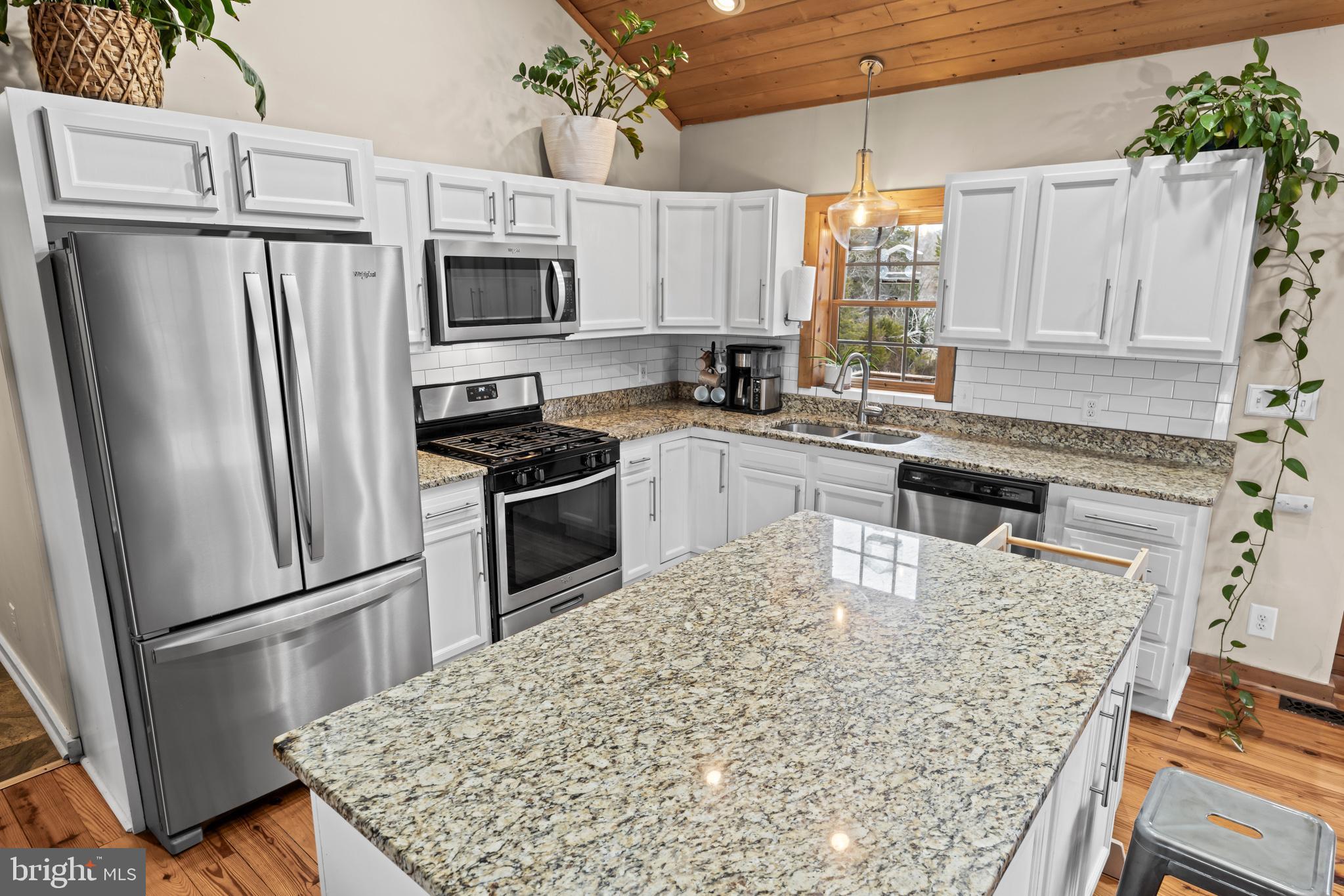 4112 Jacks Shop Road Rochelle, VA 22738 - Photo 11 of 54 a kitchen with stainless steel appliances granite countertop a refrigerator stove microwave and sink