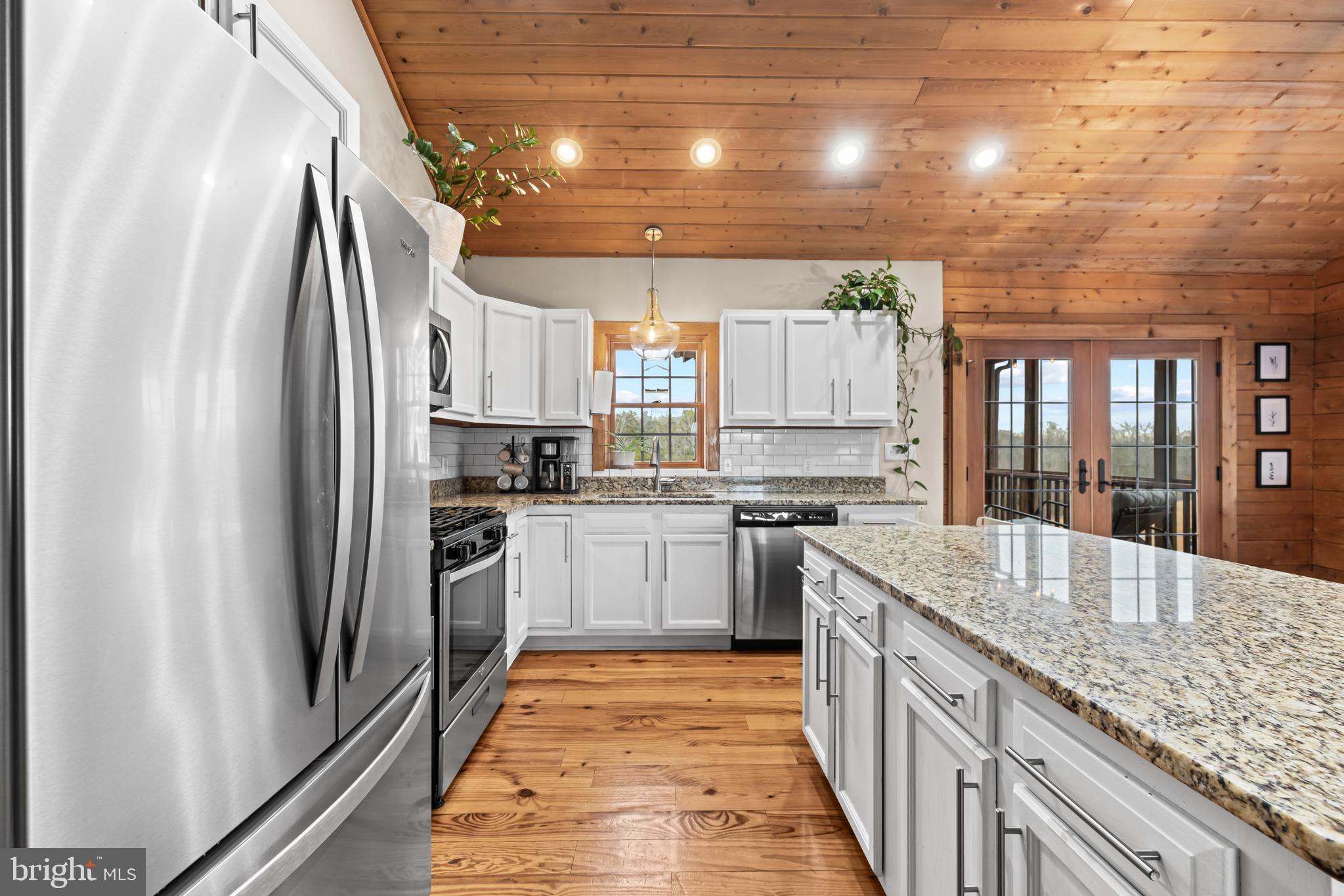 4112 Jacks Shop Road Rochelle, VA 22738 - Photo 13 of 54 a kitchen with granite countertop a refrigerator stove and sink