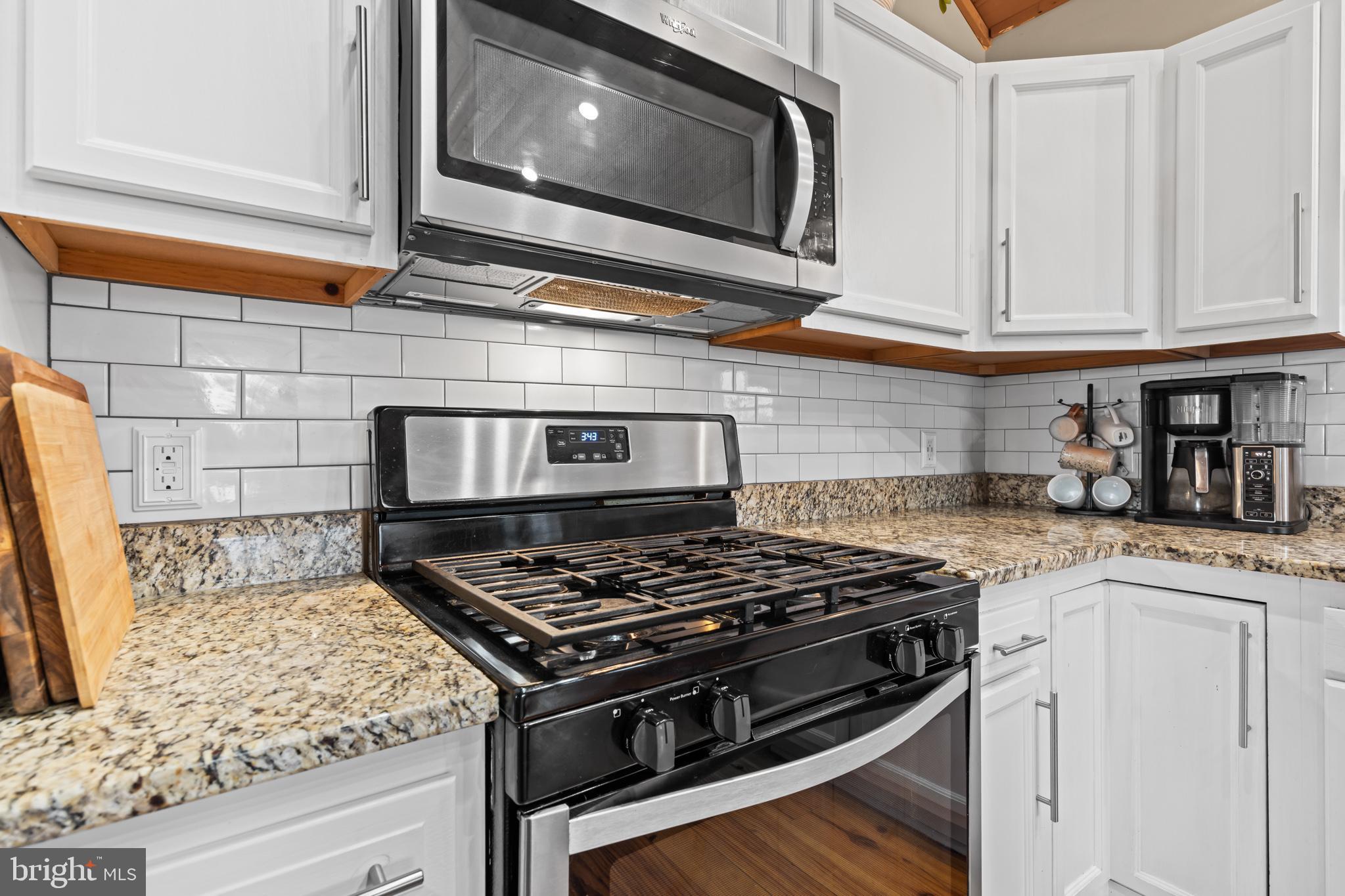 4112 Jacks Shop Road Rochelle, VA 22738 - Photo 14 of 54 a stove top oven sitting inside of a kitchen