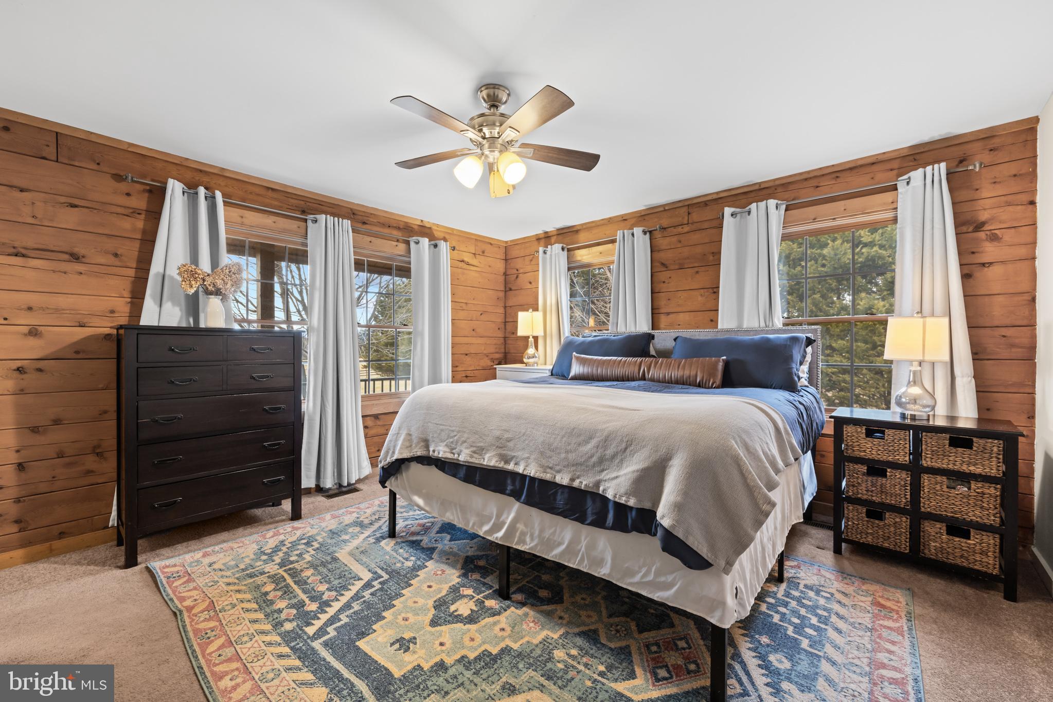4112 Jacks Shop Road Rochelle, VA 22738 - Photo 19 of 54 a bedroom with a bed a dresser and a large window