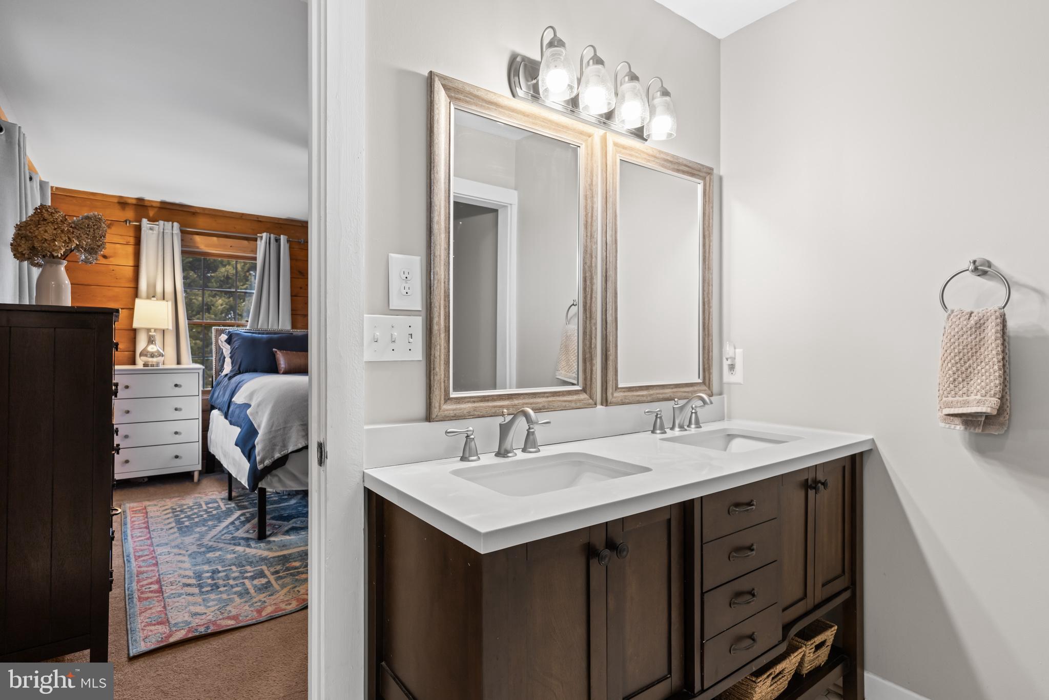 4112 Jacks Shop Road Rochelle, VA 22738 - Photo 21 of 54 a bathroom with a sink double vanity and a mirror