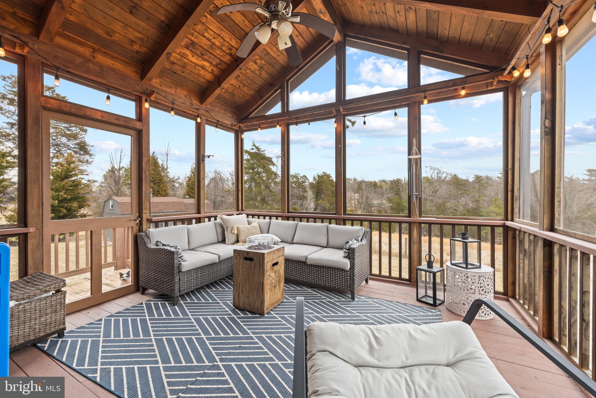 4112 Jacks Shop Road Rochelle, VA 22738 - Photo 28 of 54 a balcony with furniture and a rug