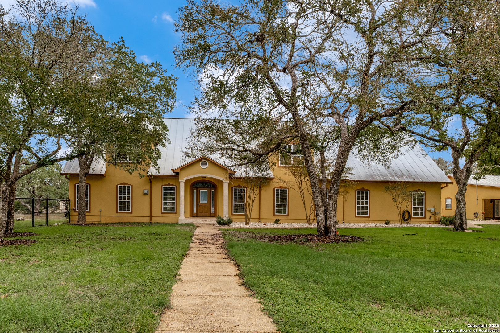 201 Yucca Canyon Spring Branch, TX 78070 - Photo 1 of 40 a front view of a house with a yard