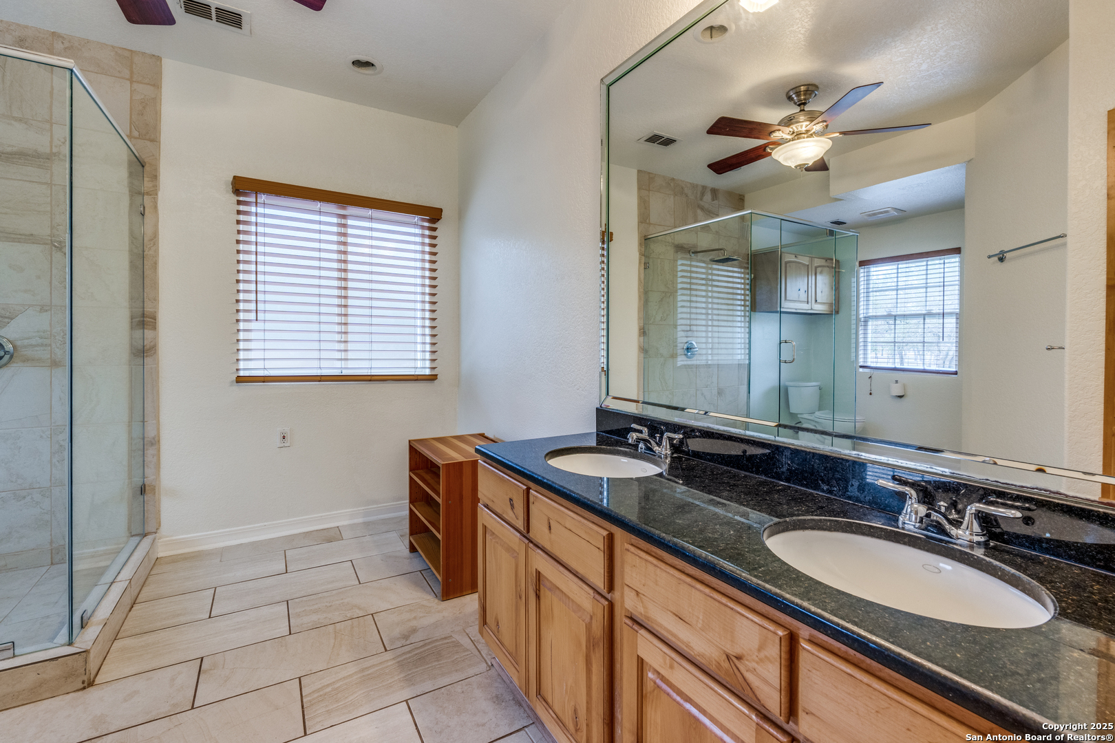 201 Yucca Canyon Spring Branch, TX 78070 - Photo 11 of 40 a bathroom with a sink double vanity and a mirror