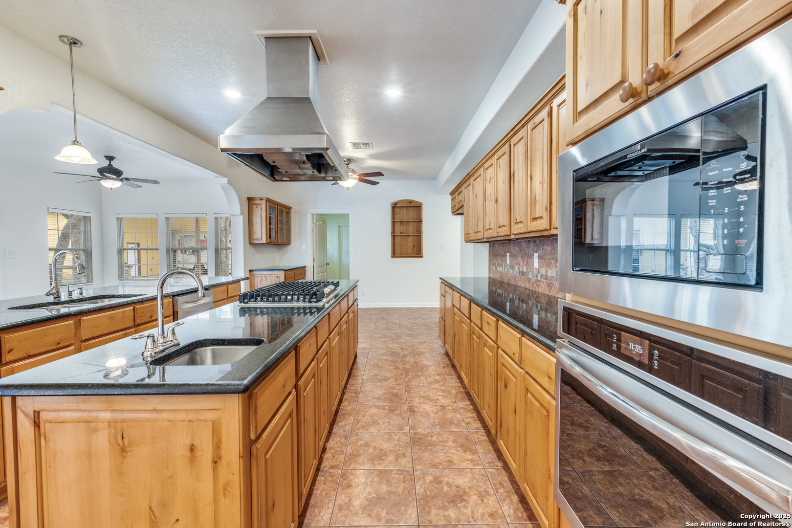 201 Yucca Canyon Spring Branch, TX 78070 - Photo 12 of 40 a kitchen with stainless steel appliances granite countertop a sink and stove