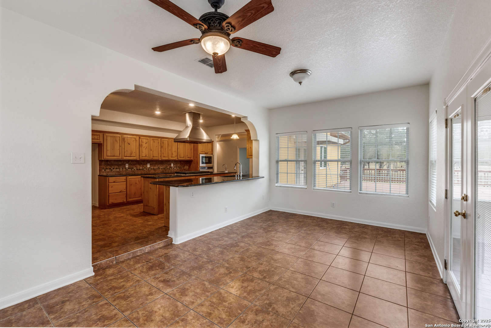 201 Yucca Canyon Spring Branch, TX 78070 - Photo 15 of 40 a view of an empty room with a kitchen