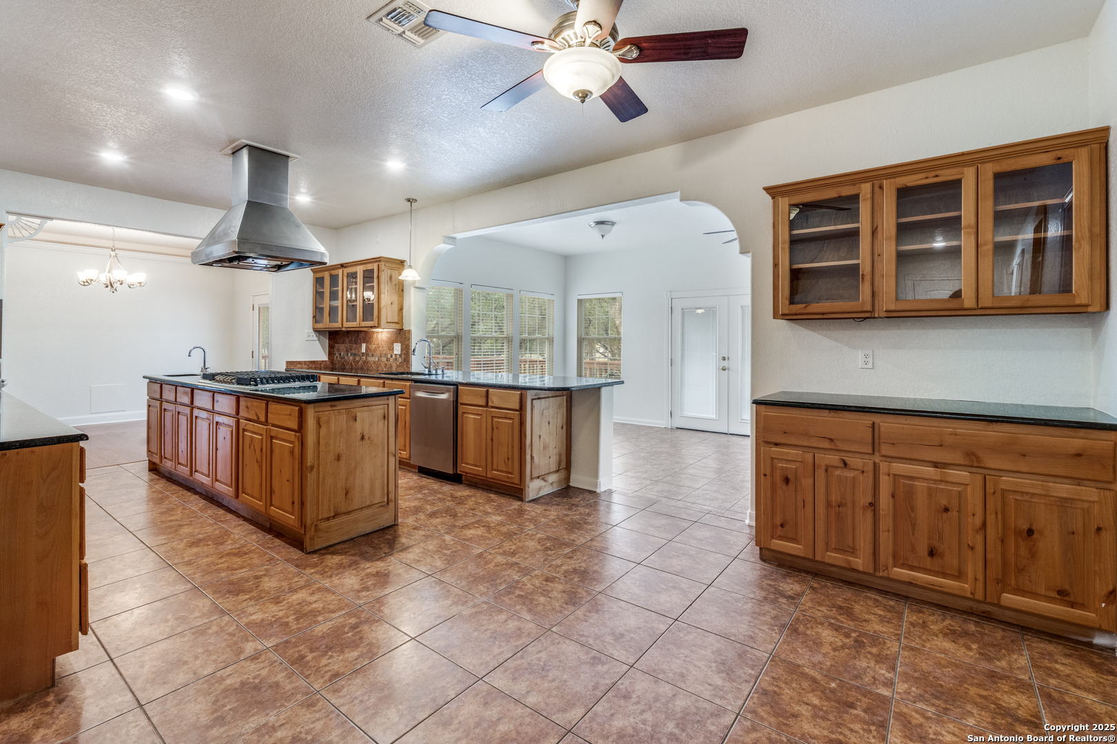 201 Yucca Canyon Spring Branch, TX 78070 - Photo 16 of 40 a kitchen with stainless steel appliances granite countertop a stove and a sink
