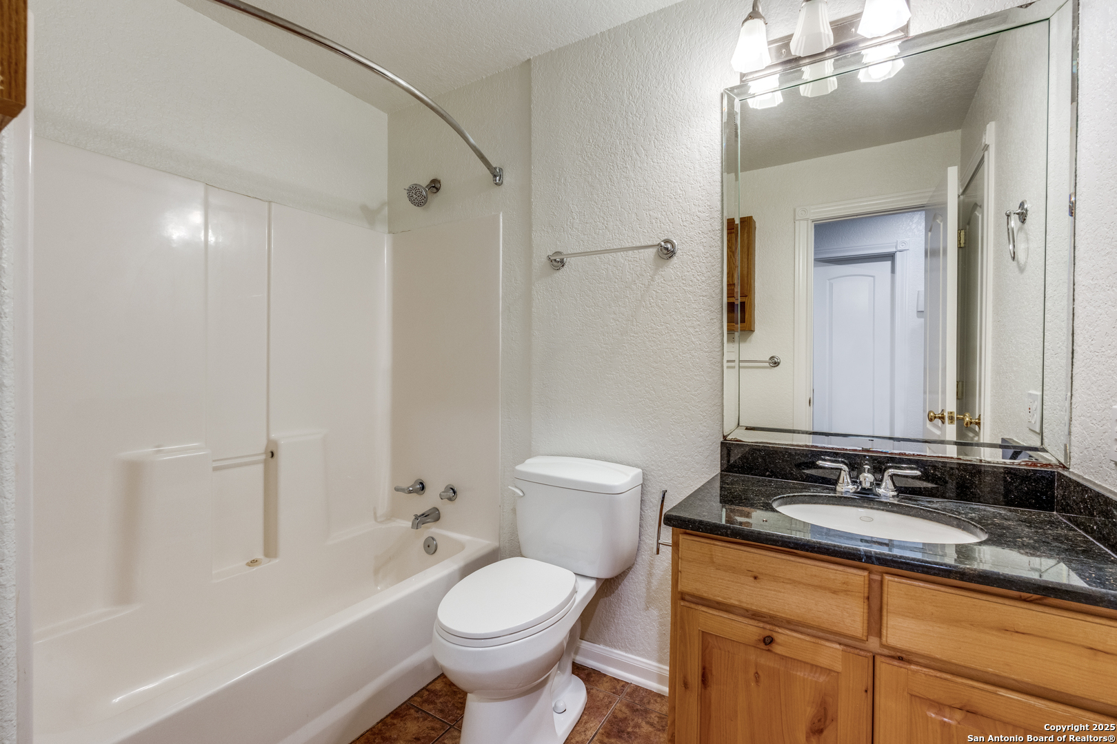 201 Yucca Canyon Spring Branch, TX 78070 - Photo 19 of 40 a bathroom with a granite countertop sink toilet and shower