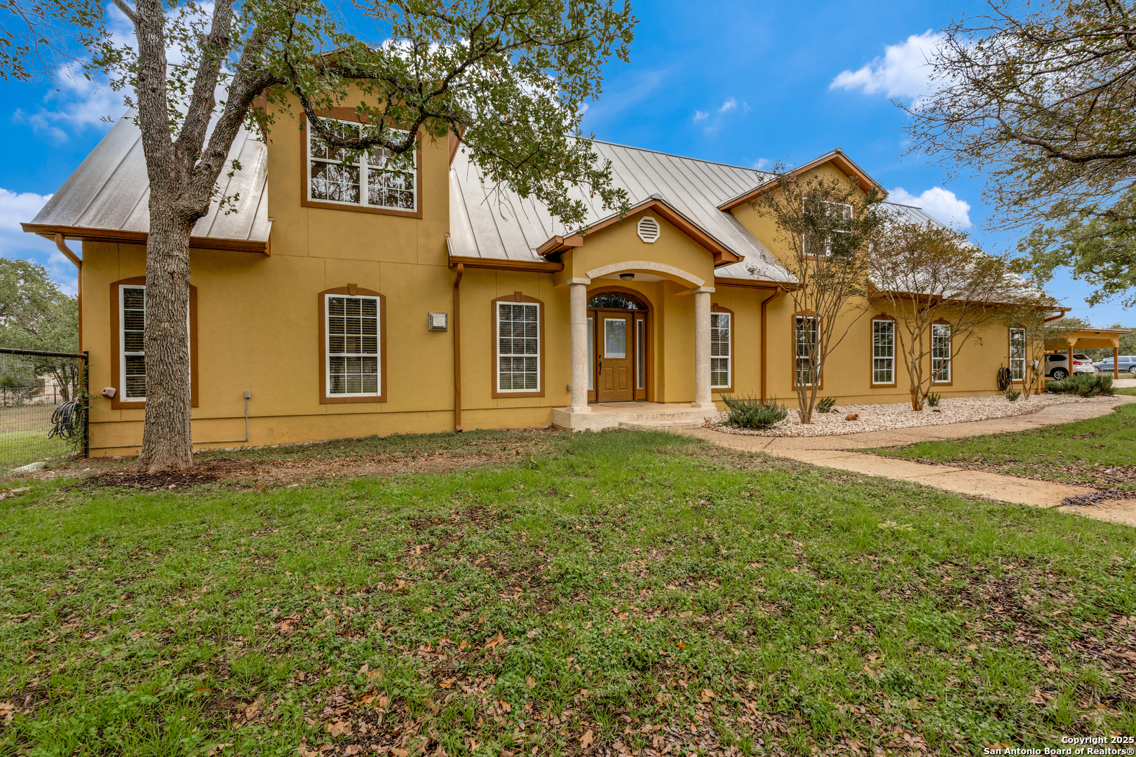 201 Yucca Canyon Spring Branch, TX 78070 - Photo 2 of 40 a front view of a house with a yard