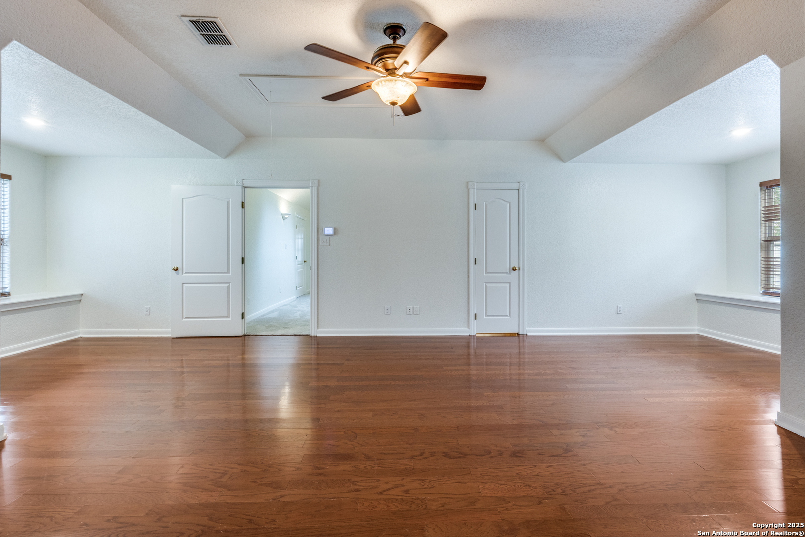201 Yucca Canyon Spring Branch, TX 78070 - Photo 21 of 40 a view of an empty room with window and wooden floor