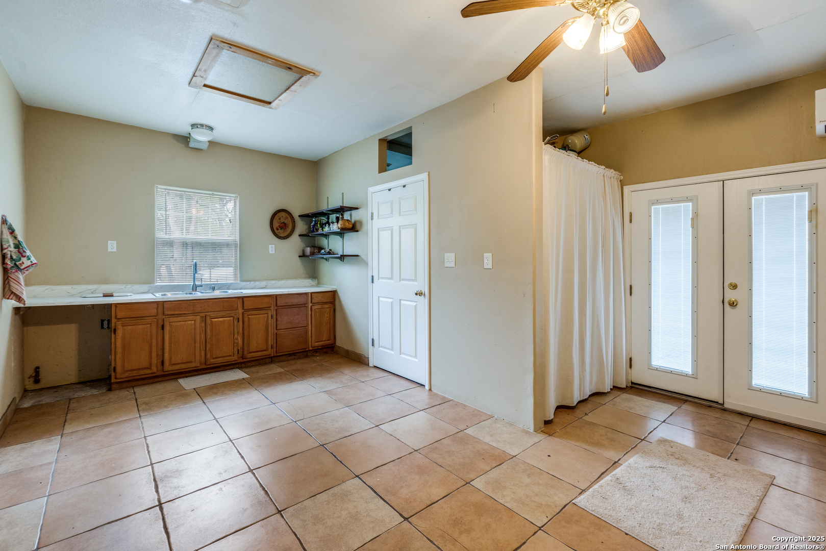 201 Yucca Canyon Spring Branch, TX 78070 - Photo 24 of 40 a kitchen with a sink a counter and a view of living room