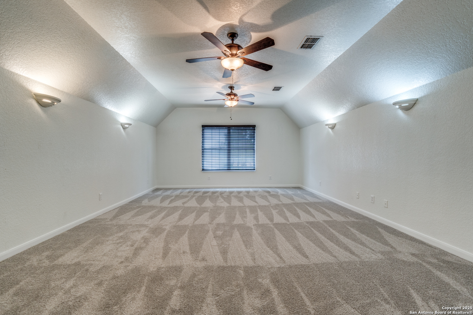 201 Yucca Canyon Spring Branch, TX 78070 - Photo 26 of 40 an empty room with ceiling fan and window