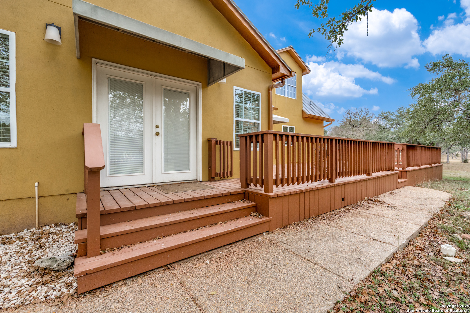 201 Yucca Canyon Spring Branch, TX 78070 - Photo 27 of 40 a view of backyard with wooden floor and a fence