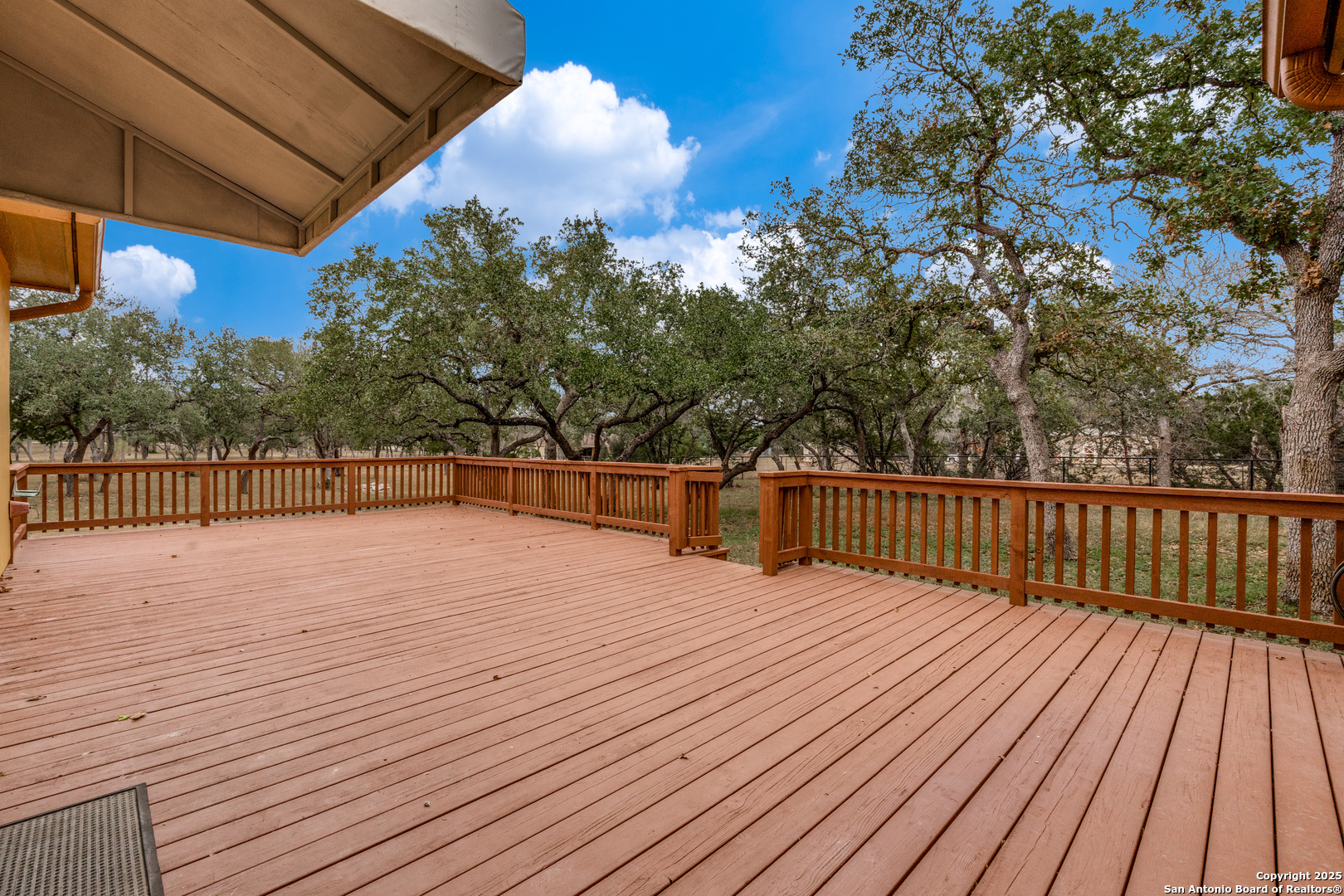 201 Yucca Canyon Spring Branch, TX 78070 - Photo 28 of 40 a view of a balcony with wooden floor and fence