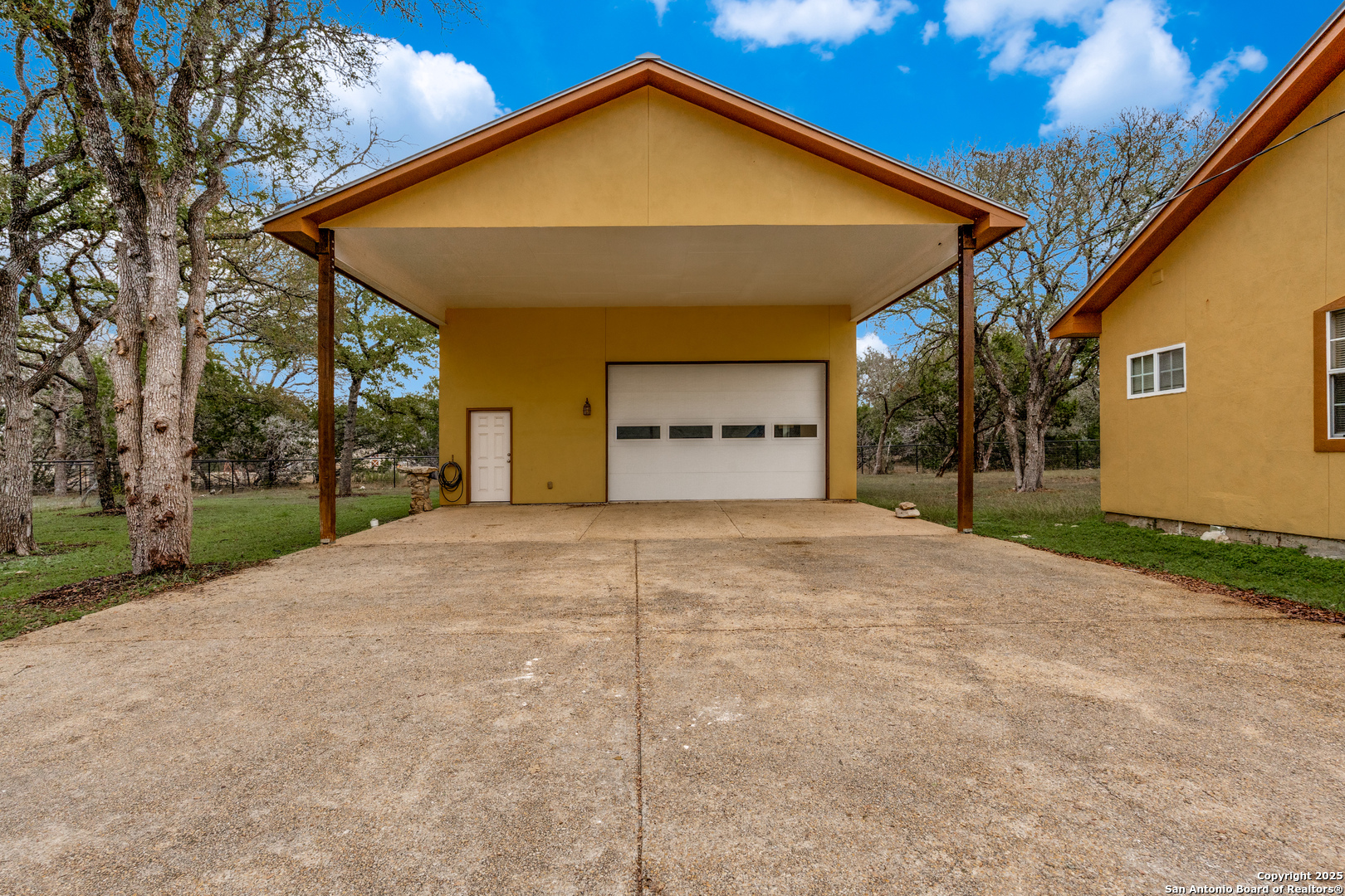 201 Yucca Canyon Spring Branch, TX 78070 - Photo 32 of 40 a view of a house with a yard