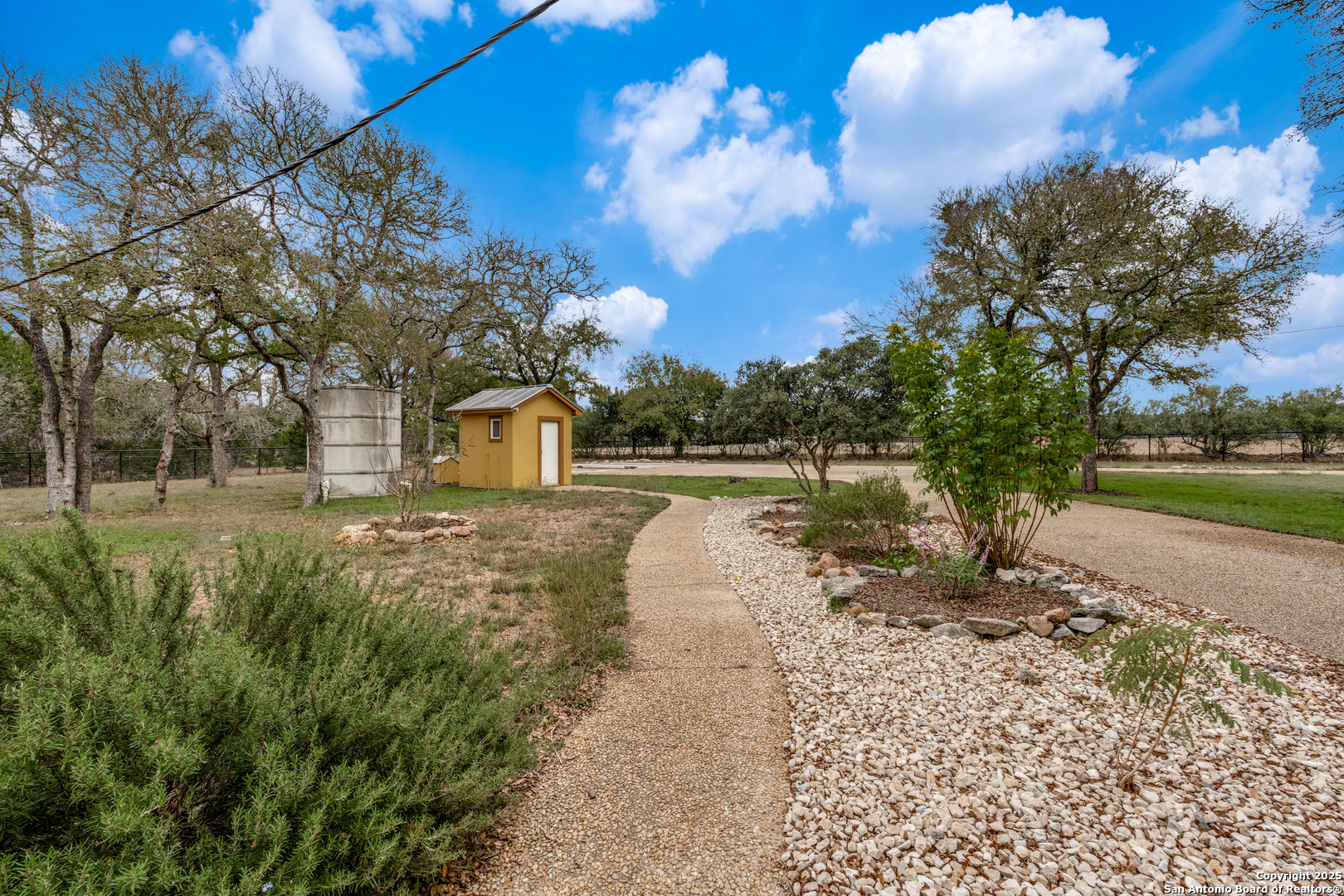 201 Yucca Canyon Spring Branch, TX 78070 - Photo 35 of 40 a view of a yard with wooden fence