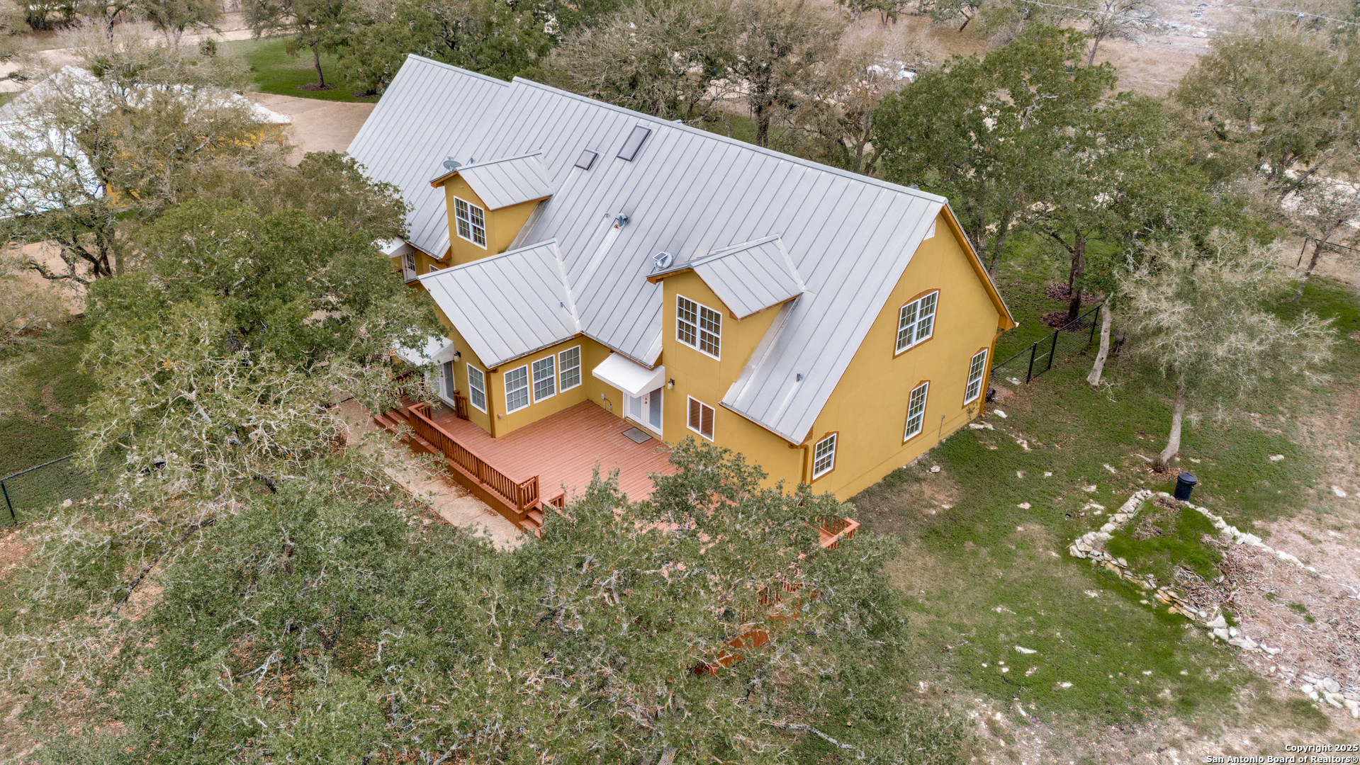 201 Yucca Canyon Spring Branch, TX 78070 - Photo 37 of 40 an aerial view of a house with yard and trees all around