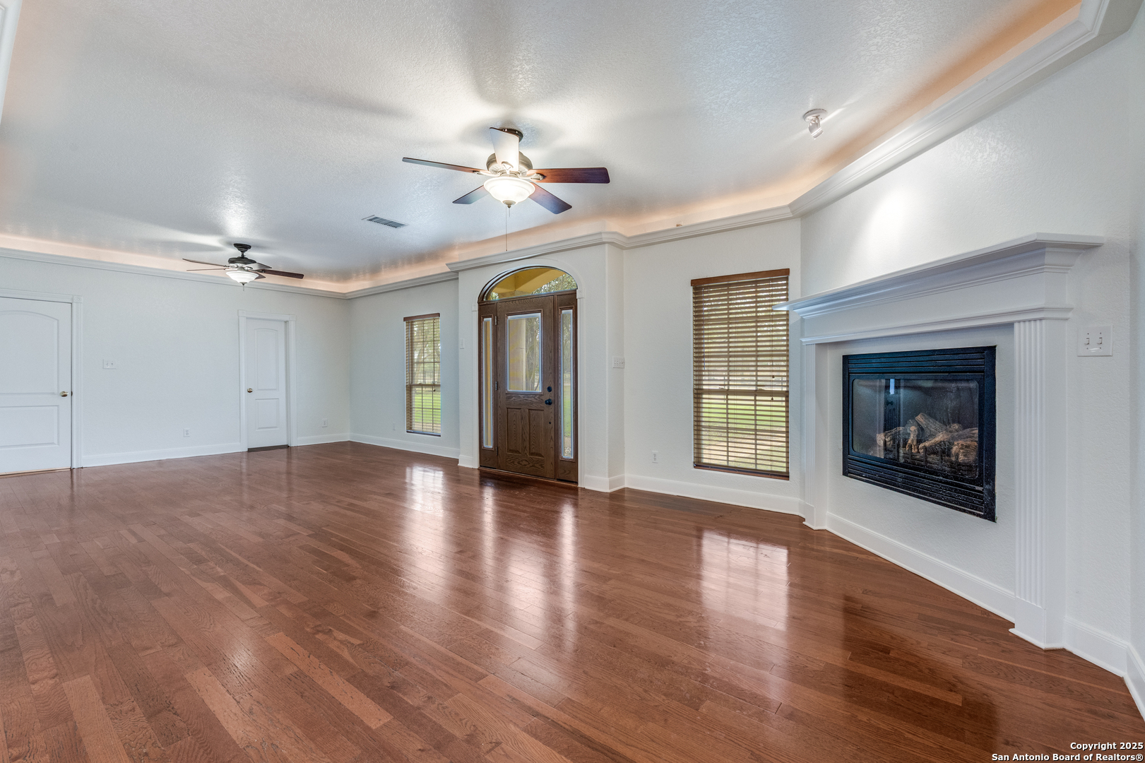 201 Yucca Canyon Spring Branch, TX 78070 - Photo 5 of 40 a view of an empty room with wooden floor and a window