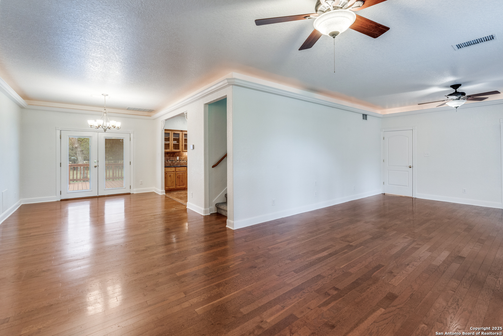 201 Yucca Canyon Spring Branch, TX 78070 - Photo 6 of 40 a view of a livingroom with a ceiling fan window and wooden floor