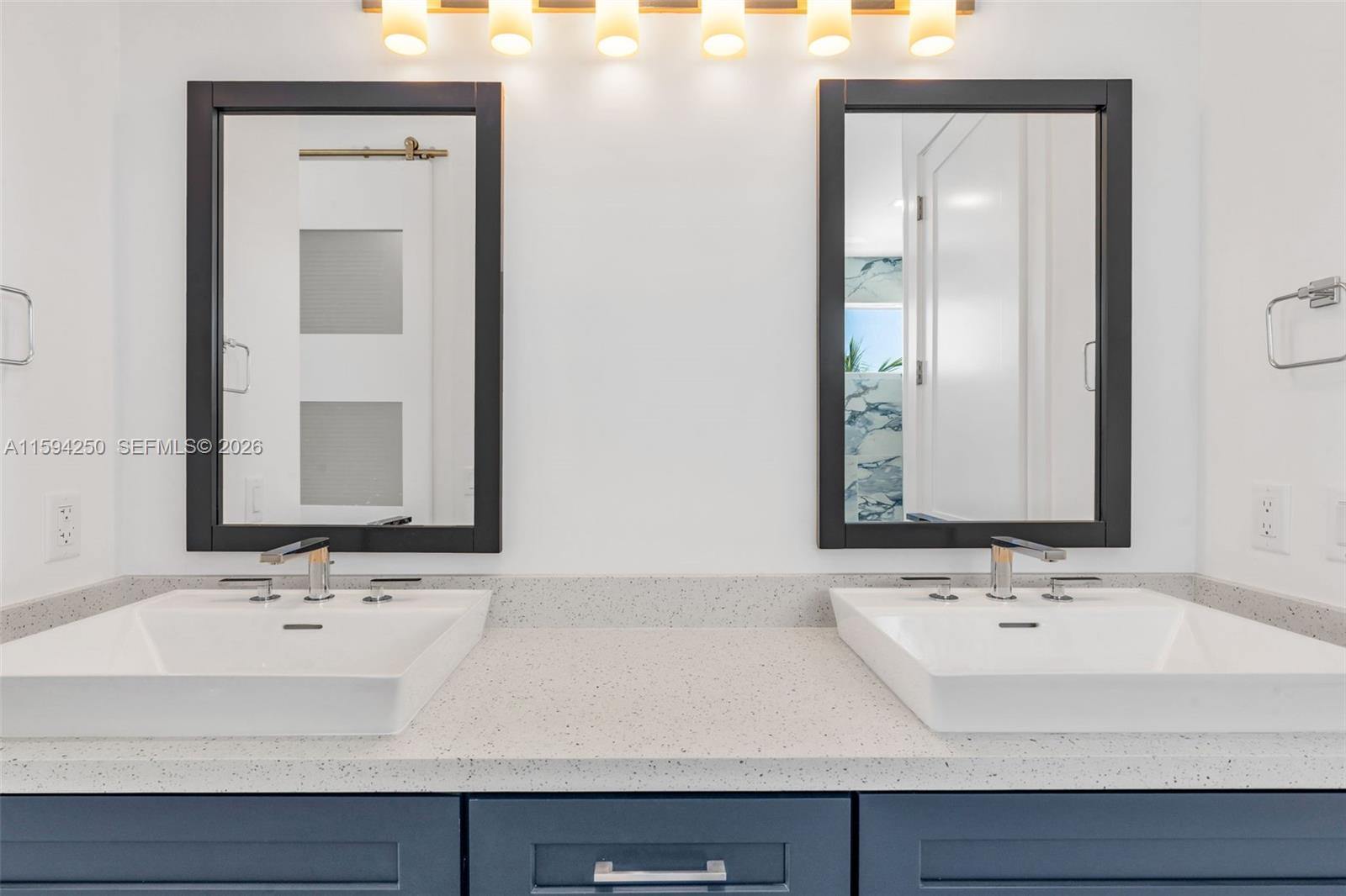 84 Coral Way Key Largo, FL 33037 - Photo 36 of 55 a bathroom with a sink and a mirror