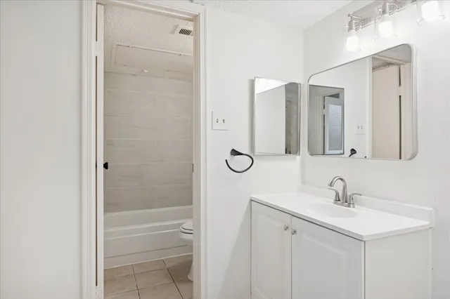 a bathroom with a double vanity sink a mirror and a shower