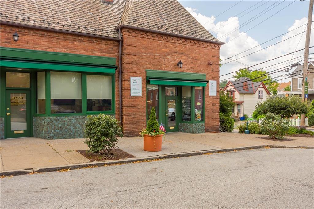 650 Pennridge Road Pittsburgh, PA 15211 - Photo 29 of 33 front view of a brick house with a patio