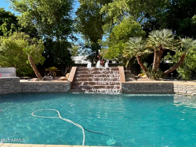 a view of a table and chairs in the garden