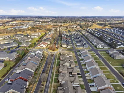 an aerial view of residential building and lake