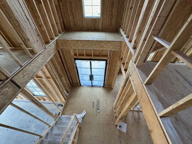 a view of an empty room with a fireplace