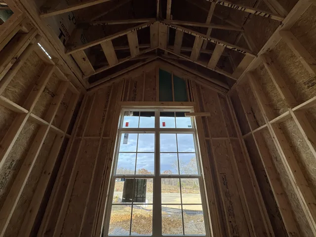 a view of a house with wooden floor and a fireplace