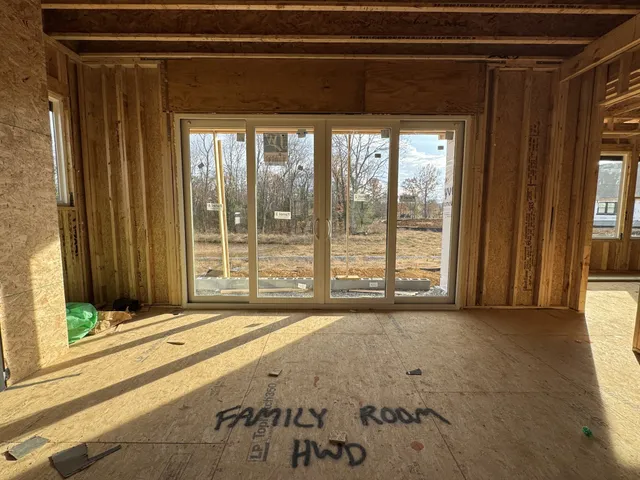 a view of an empty room with wooden walls