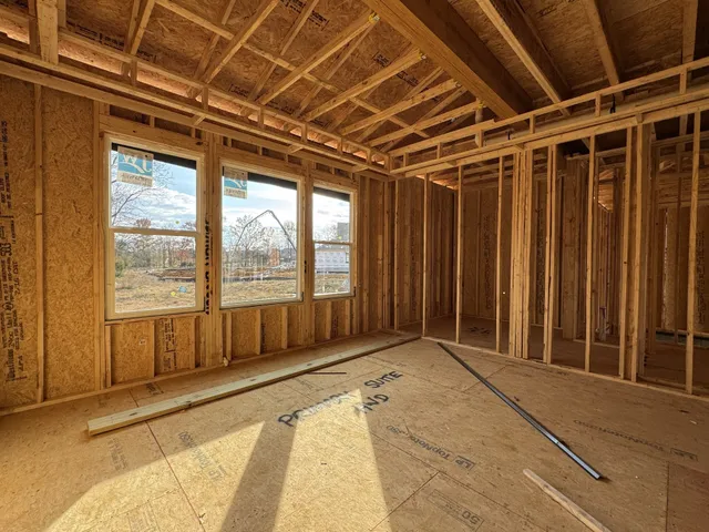 a view of an empty room with wooden walls