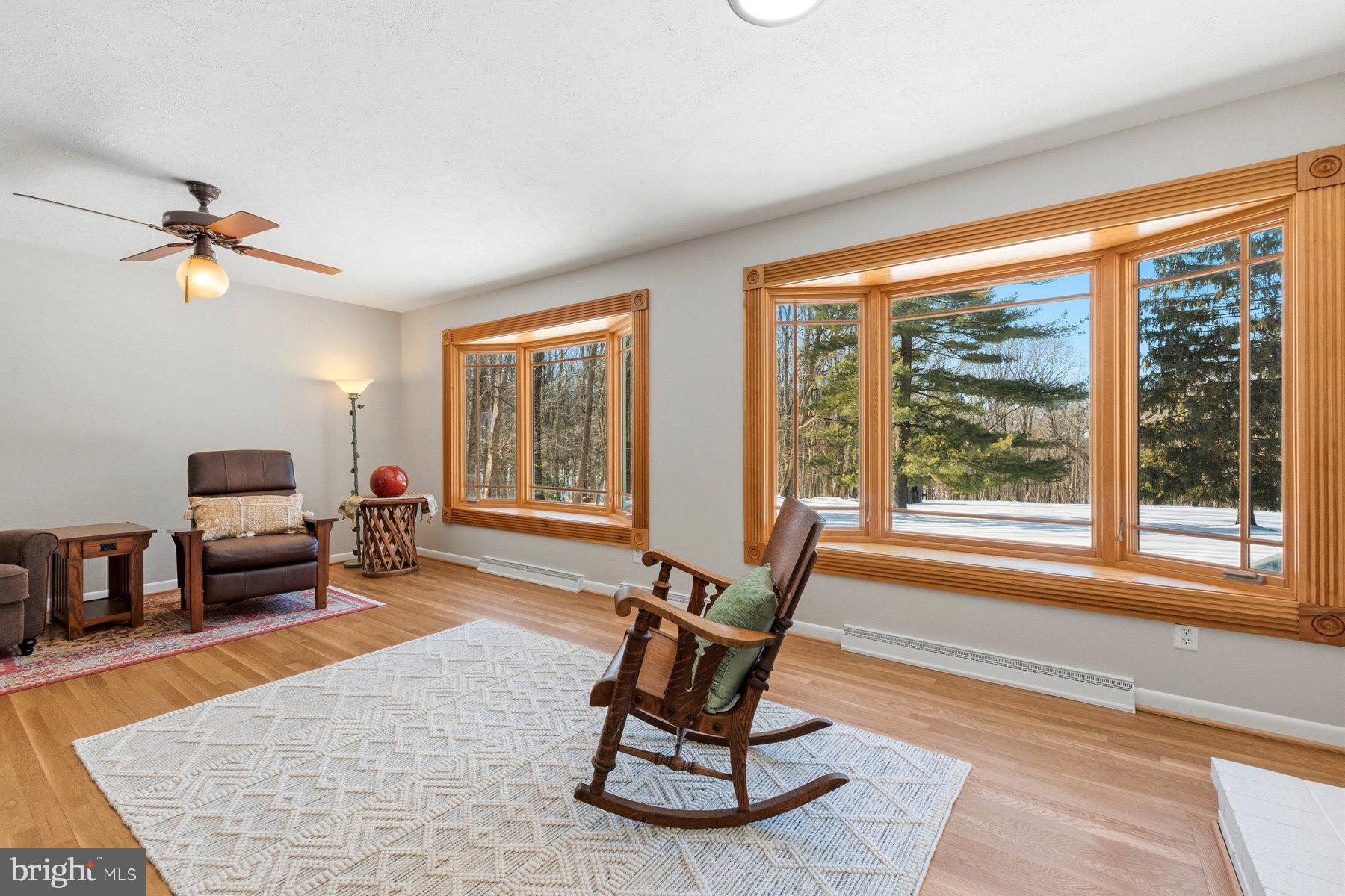 15200 Berryville Road Germantown, MD 20874 - Photo 12 of 42 a living room with furniture and a floor to ceiling window