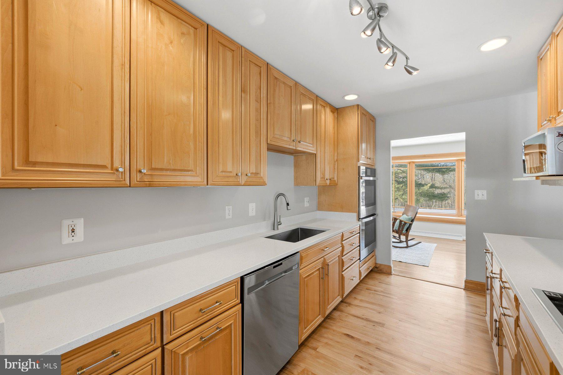 15200 Berryville Road Germantown, MD 20874 - Photo 14 of 42 a kitchen with sink cabinets and window