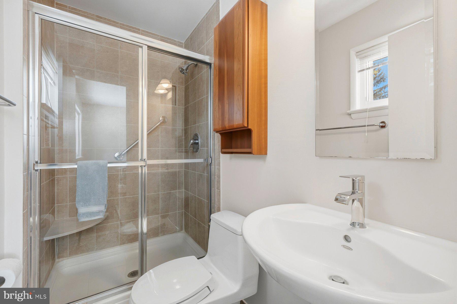 15200 Berryville Road Germantown, MD 20874 - Photo 26 of 42 a bathroom with a sink toilet and shower