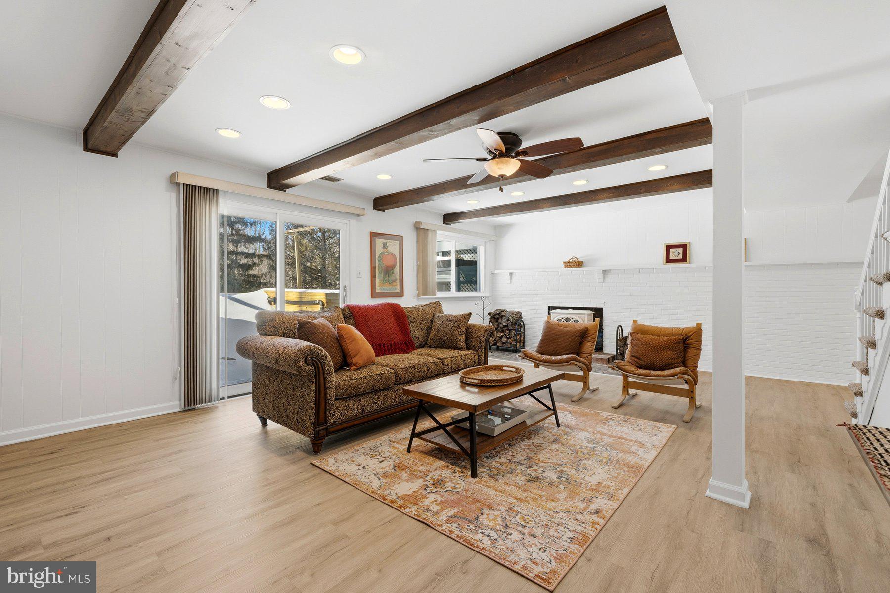 15200 Berryville Road Germantown, MD 20874 - Photo 32 of 42 a living room with furniture and wooden floor