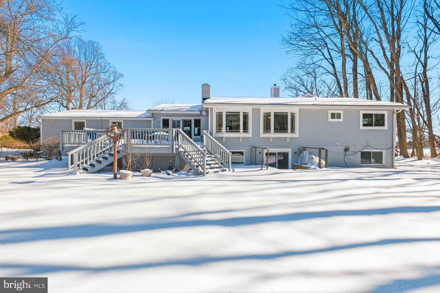 15200 Berryville Road Germantown, MD 20874 - Photo 4 of 42 a front view of a house with a yard