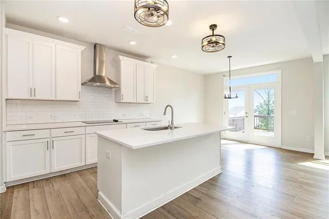 a kitchen with a sink cabinets and window