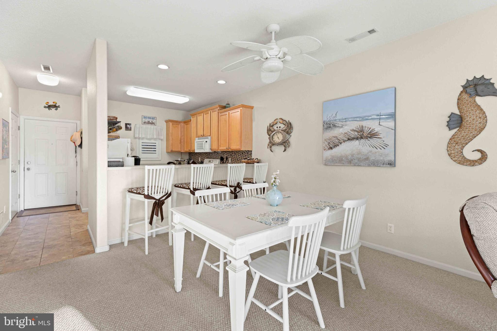 33192 North Village Loop, Unit 5202 Lewes, DE 19958 - Photo 13 of 42 Dining room with ceiling fan and counter access