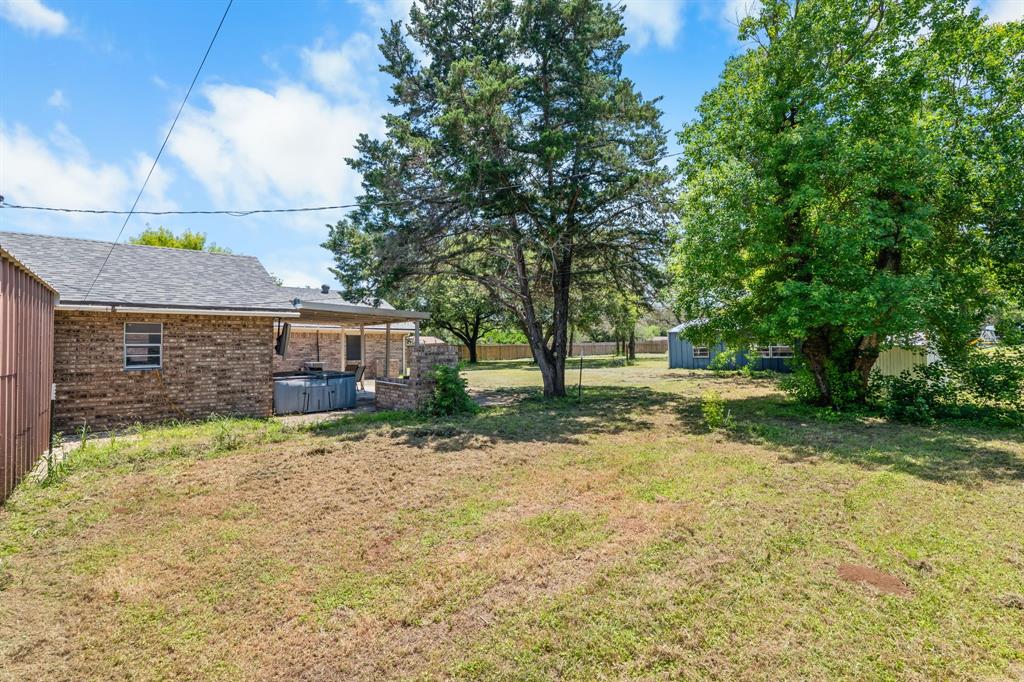 373 Ingred Street Waco, TX 76705 - Photo 26 of 39 a view of a yard with plants and a tree