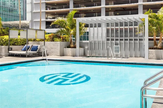 a view of pool with outdoor seating