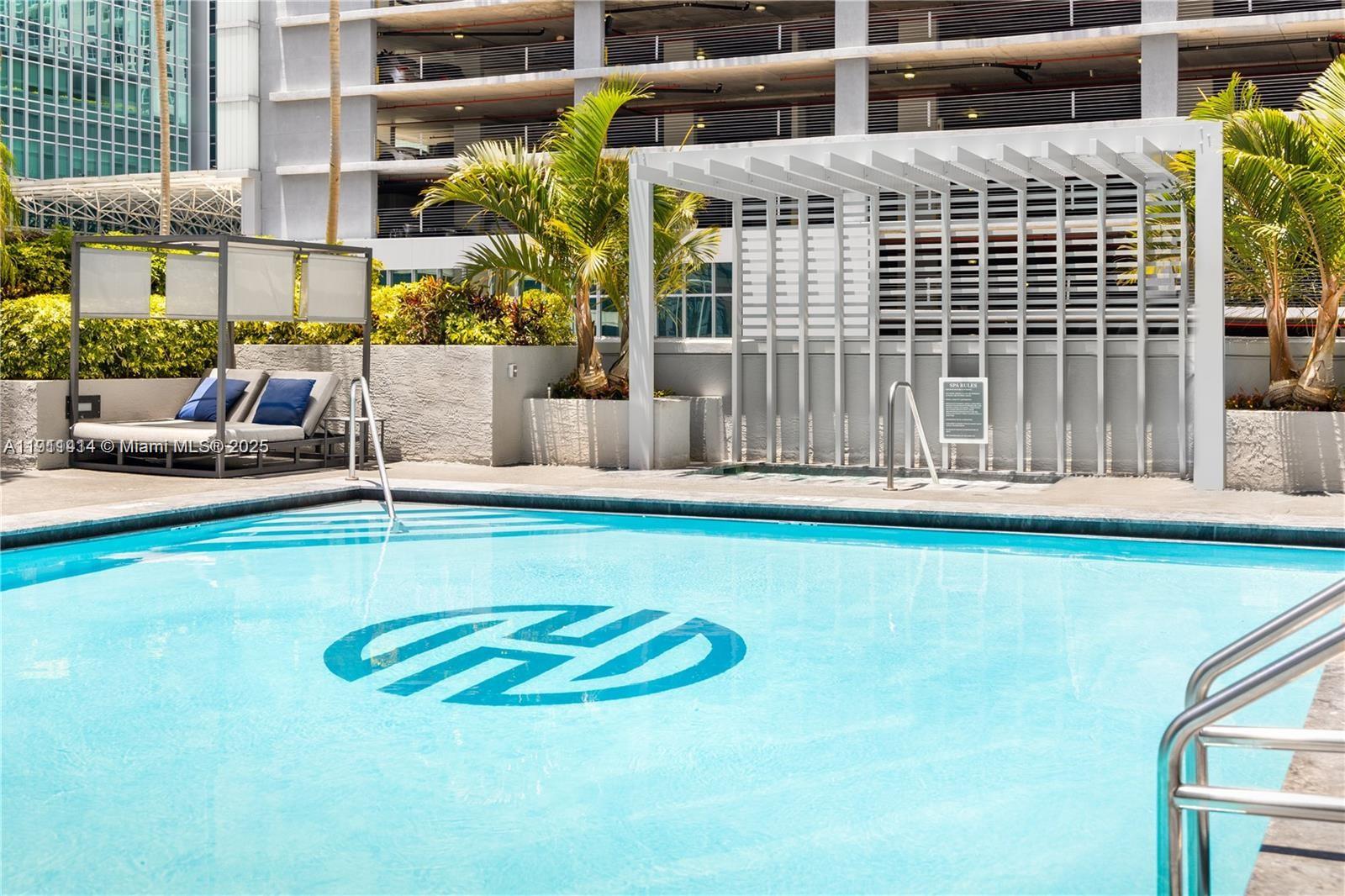 185 Southeast 14th Terrace, Unit 712 Miami, FL 33131 - Photo 6 of 9 a view of pool with outdoor seating