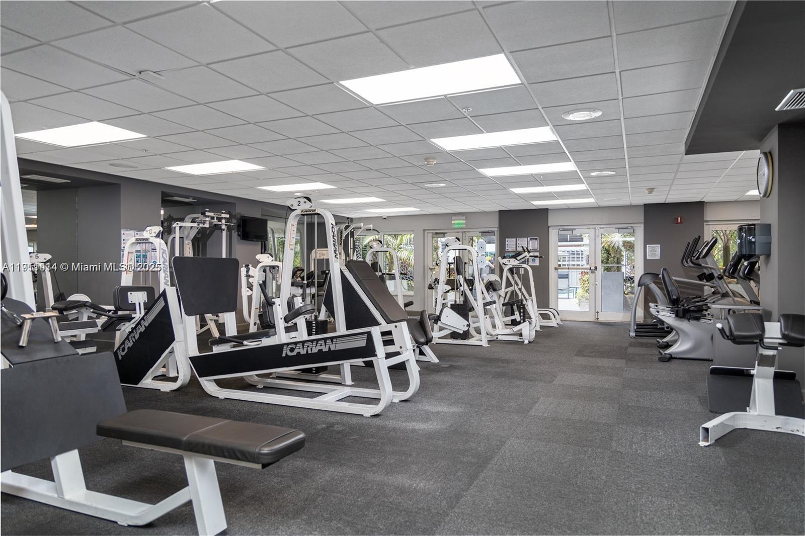 185 Southeast 14th Terrace, Unit 712 Miami, FL 33131 - Photo 8 of 9 a view of a room with gym equipment