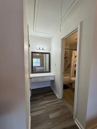 a bedroom with a bed and a painting