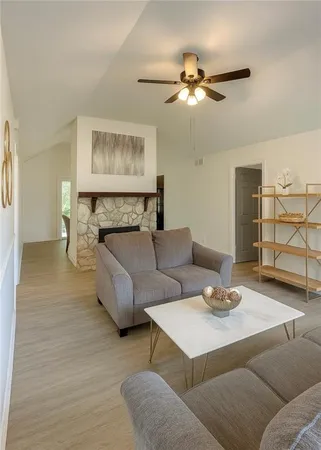 a bedroom with two beds and painting on the wall