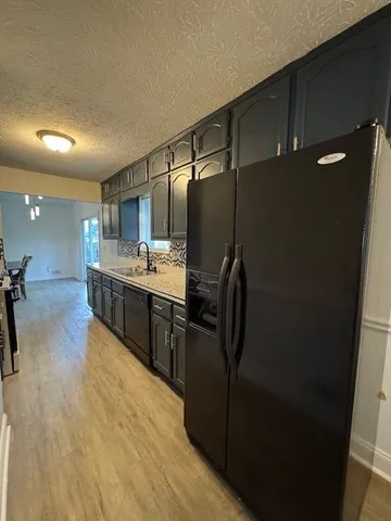 a room with a bed and cabinets