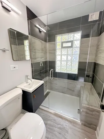 a bathroom with a sink a toilet and bathtub