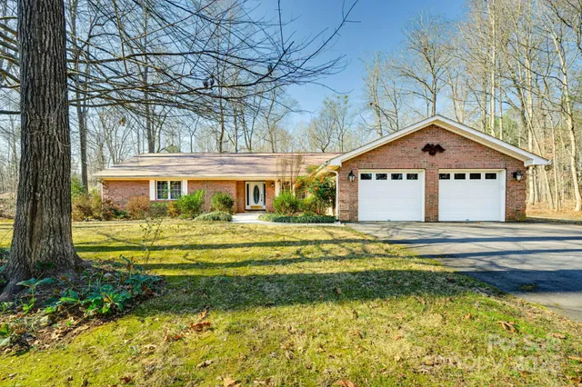 a front view of a house with a yard table and chairs