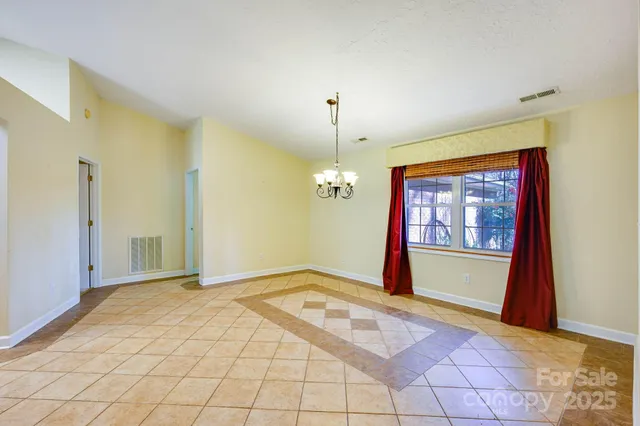 a white toilet sitting next to a bathroom sink and vanity